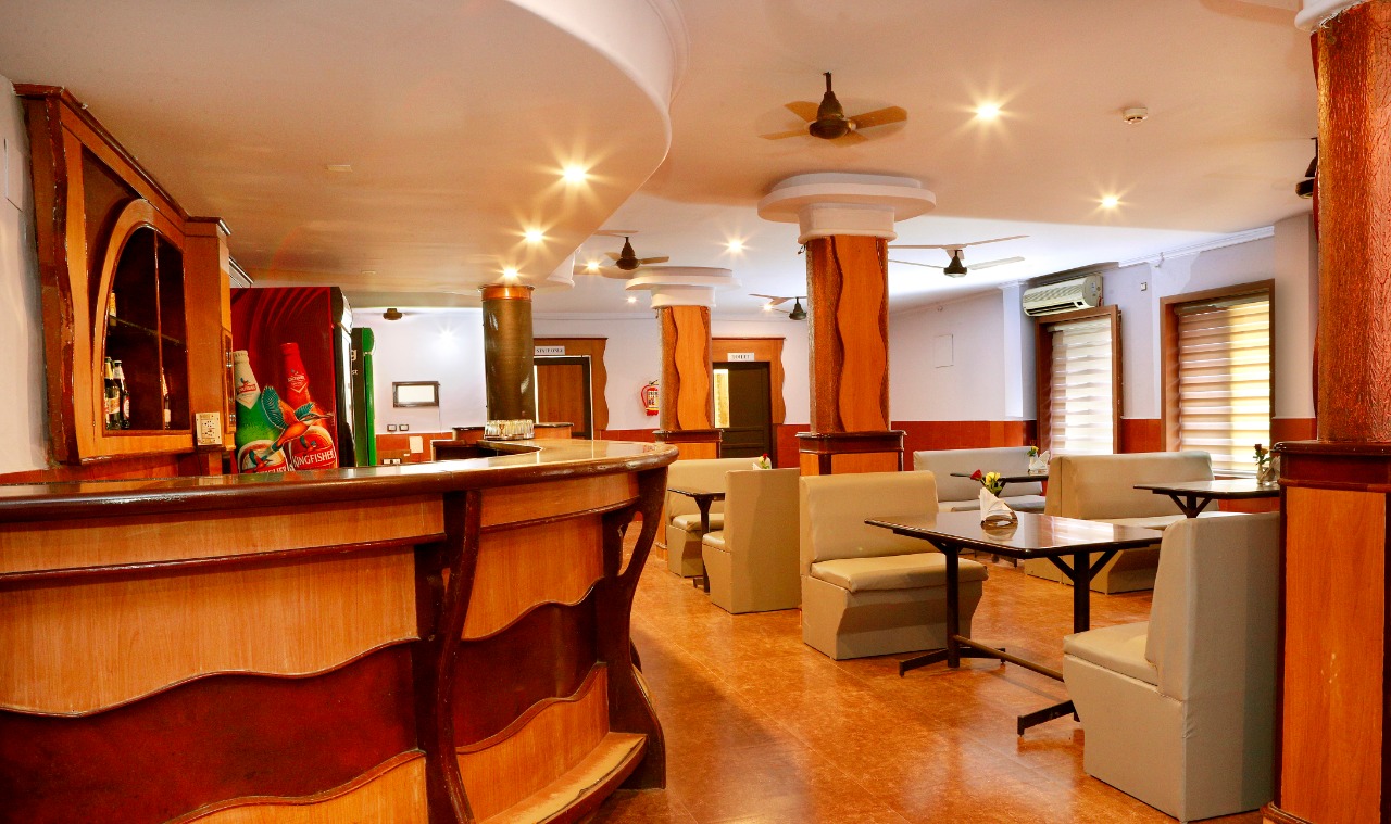 Bar and lounge with wooden counter and booth seating